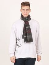 Close-up of a charcoal grey, black and red checked men’s muffler with tartan plaid pattern and fringed edge.