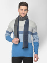 Close-up of a navy blue and grey checked men’s muffler with broad plaid pattern.