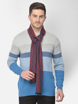 Close-up of a maroon and navy blue printed men’s muffler with geometric triangle pattern.
