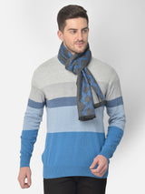 Close-up of a charcoal grey and royal blue printed men’s muffler with geometric diamond pattern.