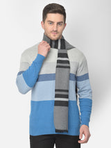 Man wearing a grey and black broad-striped men’s muffler on a white background.