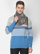 Man wearing a charcoal grey and taupe checked men’s muffler on a white background.