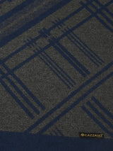 Close-up of a dark grey and navy blue printed men’s muffler with geometric line pattern and Cazzano label.