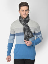 Man wearing a black and grey printed men’s muffler with abstract geometric pattern.