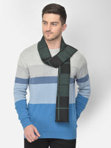Man wearing a dark green and black checked men’s muffler.