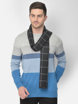 Close-up of a black and grey checked men’s muffler with windowpane pattern.