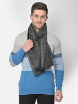 Man wearing a charcoal grey and black checked muffler.