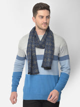 Navy blue and olive green printed men’s muffler with houndstooth pattern.