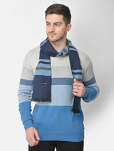 Close-up of a navy blue and light blue checked men’s muffler.