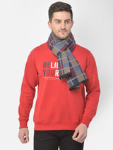 Close-up of a navy blue, beige and red checked men’s muffler fabric with Cazzano label.