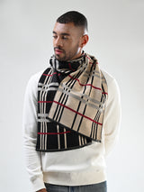 Man wearing a beige, black and red checked men’s muffler with tartan plaid pattern.