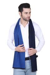 Man wearing a royal blue and black checked men’s muffler with fine micro-grid pattern.