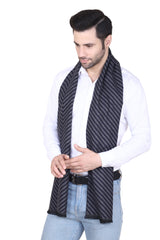 Black and grey men’s muffler with fine diagonal stripe pattern and fringed edge on a white background.