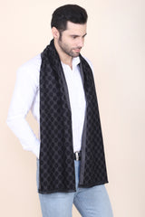 Man wearing a black and grey printed men’s muffler with honeycomb geometric pattern.