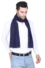 Man wearing a navy blue checked men’s muffler with royal blue windowpane pattern.